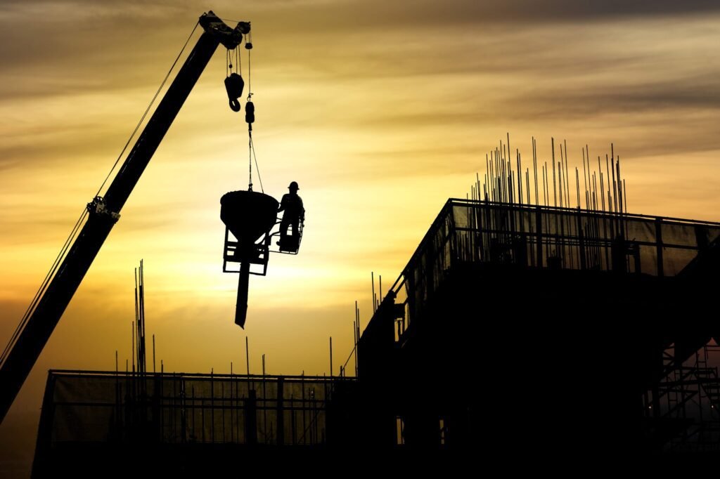 Silhouette crane construction building at sunset, Industrial construction